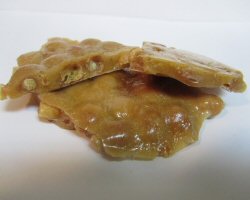 A piece of peanut brittle from the side